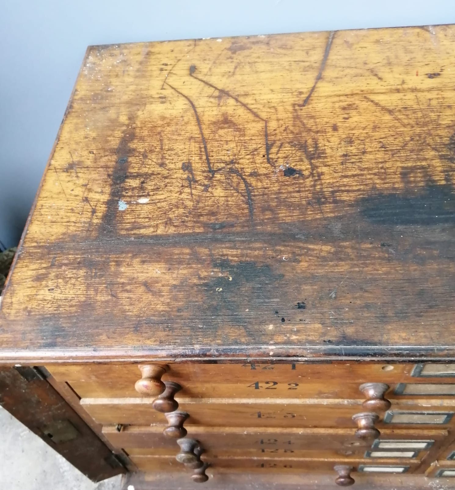 A large Victorian oak geological specimen cabinet, fitted 18 drawers with side locking bars, width 183cm, depth 63cm, height 77cm